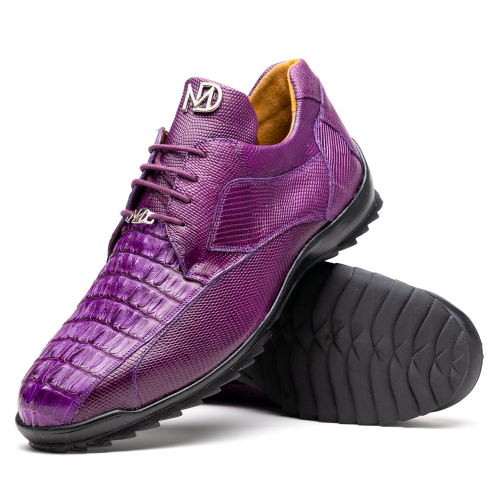 The Marco Di Milano Crater Purple sneakers showcase bold, textured elegance with their purple lizard skin and black rubber soles—luxury men’s footwear where one sneaker stands upright and the other leans.