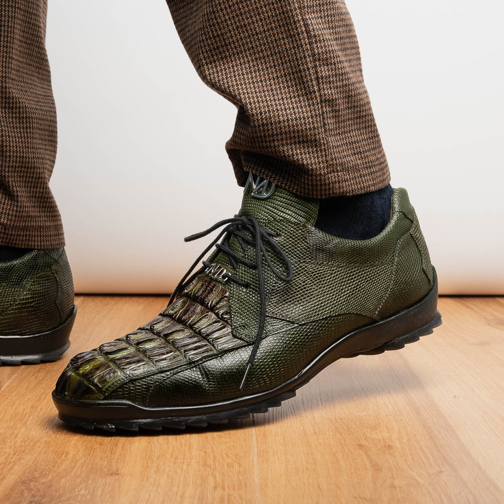 The Marco Di Milano Crater Rustic Olive sneakers boast green textured leather with a crocodile pattern, black soles and laces, hand-painted finishes, and metallic "ND" logos—ideal for true luxury footwear enthusiasts.
