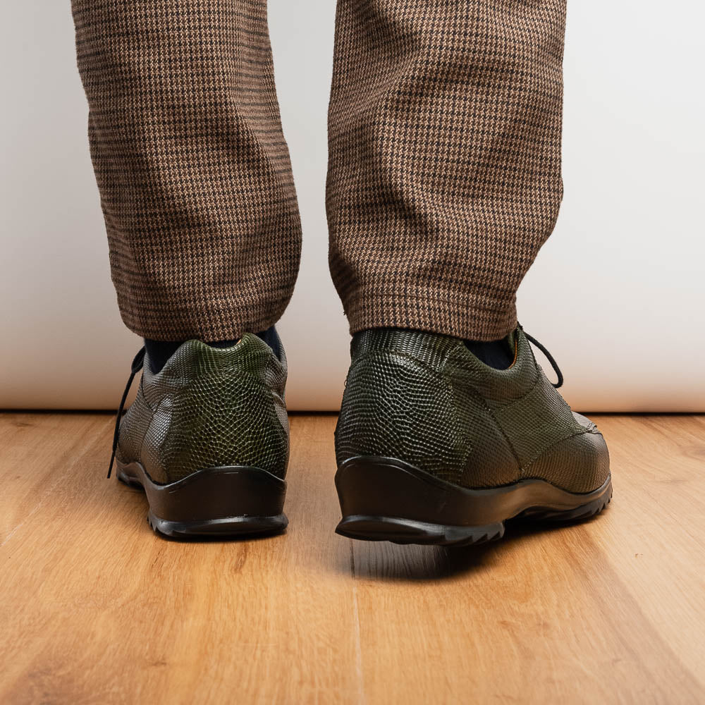 The Marco Di Milano Crater Rustic Olive sneakers boast green textured leather with a crocodile pattern, black soles and laces, hand-painted finishes, and metallic "ND" logos—ideal for true luxury footwear enthusiasts.