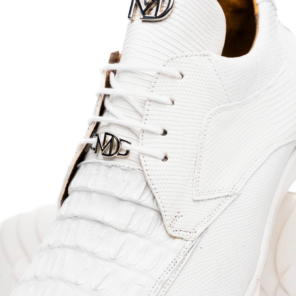 The Crater White sneakers by Marco Di Milano feature white textured leather lizard skin and a lace-up closure; one shoe stands upright while the other is tilted to reveal the sole.