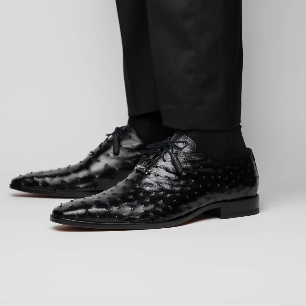 The Marco Di Milano Criss Black is a pair of genuine ostrich quill Oxford shoes with red interior lining and tan leather soles—ideal for luxury footwear enthusiasts seeking refined style.