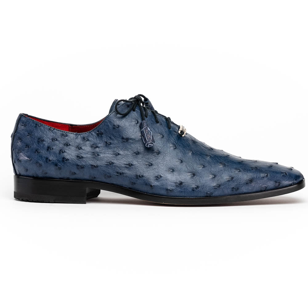 The Criss Navy by Marco Di Milano: a pair of genuine ostrich dress shoes with blue leather, black laces, red inner lining, and brown soles—one upright, one on its side—showcasing luxury men’s footwear.