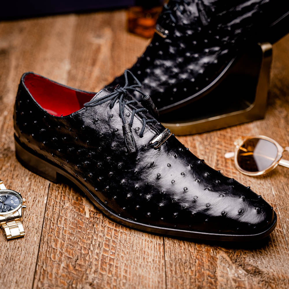 The Marco Di Milano Criss Black is a pair of genuine ostrich quill Oxford shoes with red interior lining and tan leather soles—ideal for luxury footwear enthusiasts seeking refined style.