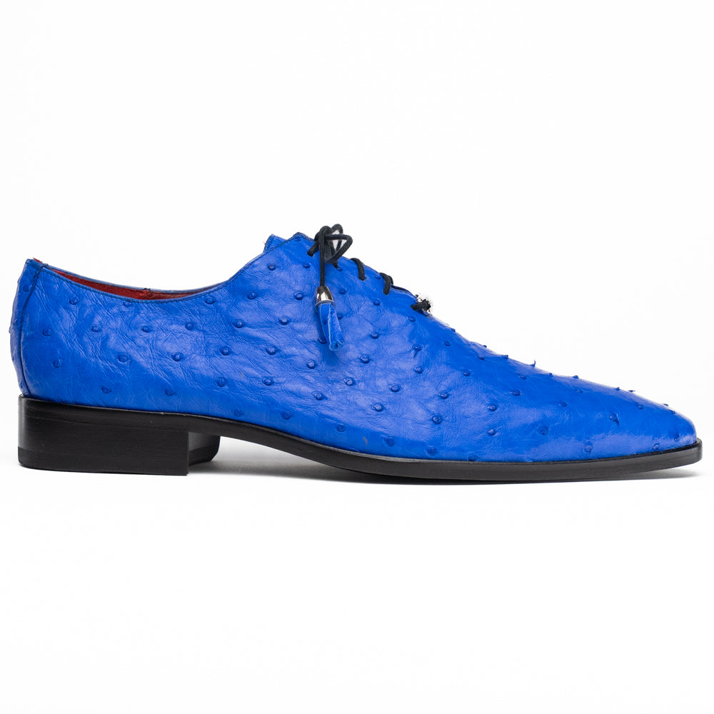 Introducing the Criss Electric Blue by Marco Di Milano—a pair of vibrant blue genuine ostrich quill leather oxford dress shoes featuring stylish laces and sleek metal detailing. One shoe stands upright while the other displays its beautifully crafted sole, making them an exceptional choice for anyone looking for distinctive luxury footwear.