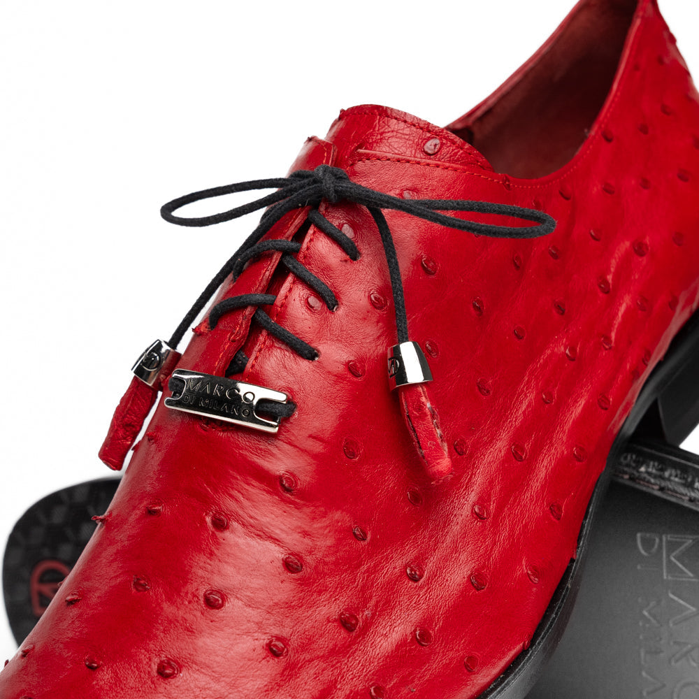 Introducing the Criss Red by Marco Di Milano: a pair of striking red genuine ostrich quill leather dress oxford shoes with black laces—one elegantly upright and the other displayed on its side to showcase the luxurious sole. This luxury footwear commands attention at every step.