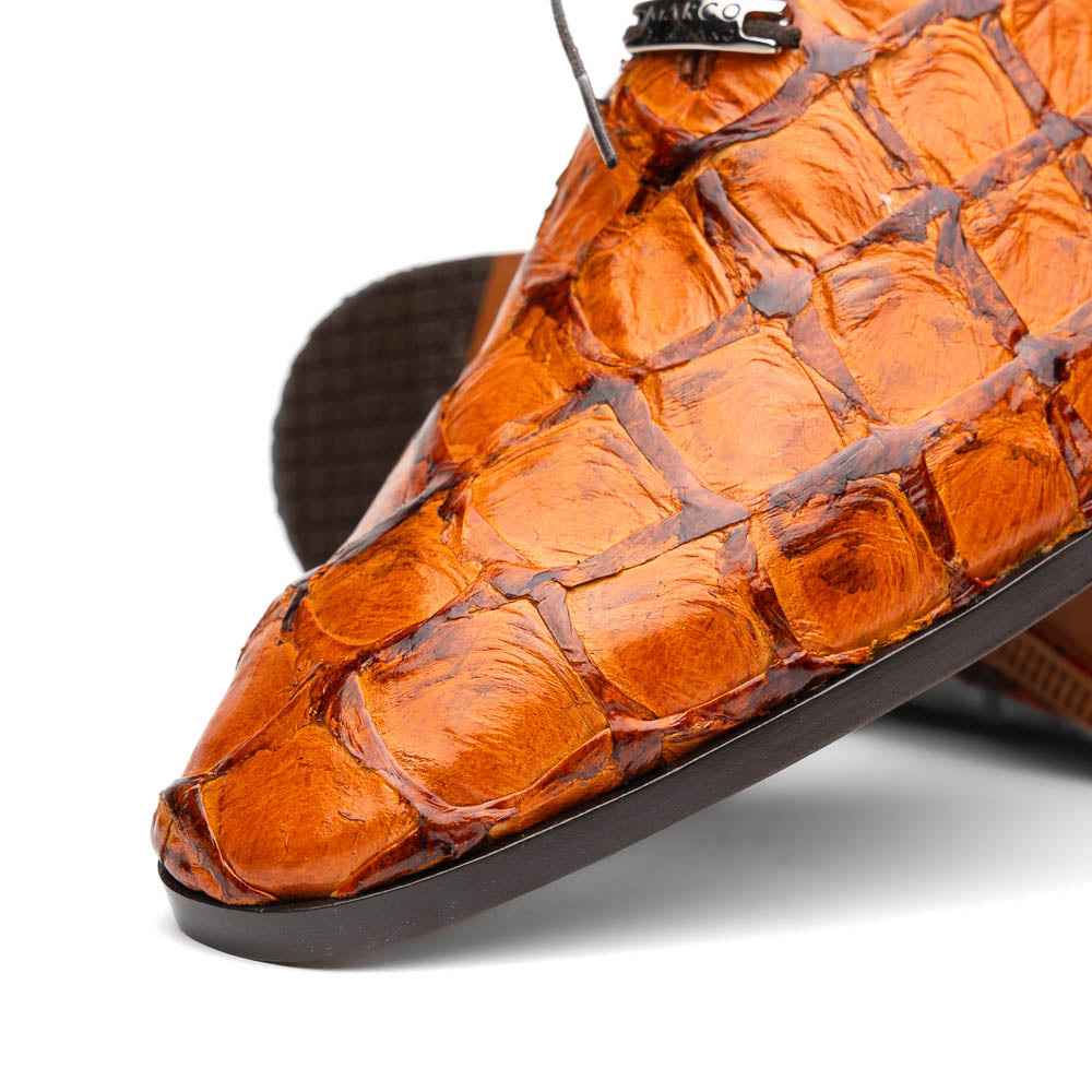A pair of Olivieri Brandy by Marco Di Milano luxury dress oxford shoes in orange-brown crocodile leather with dark laces, one shoe shown on its side highlighting the branded sole.