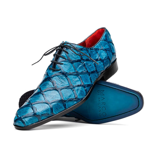 A pair of Marco Di Milano Olivieri Caribbean Blue crocodile leather oxfords with red interior lining; one shoe stands upright, the other shows its sole with "Marco Di Milano" branding.