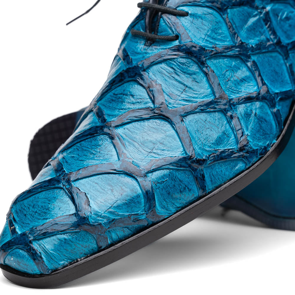 A pair of Marco Di Milano Olivieri Caribbean Blue crocodile leather oxfords with red interior lining; one shoe stands upright, the other shows its sole with "Marco Di Milano" branding.