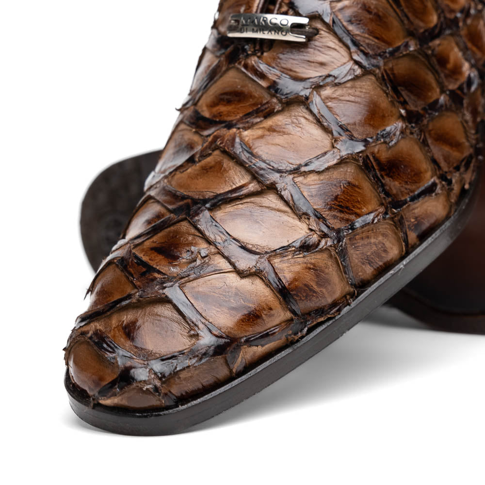 The Olivieri Clear Brown oxford shoes by Marco Di Milano showcase a textured crocodile leather design; one shoe stands upright as the other lies on its side, displaying the sole.