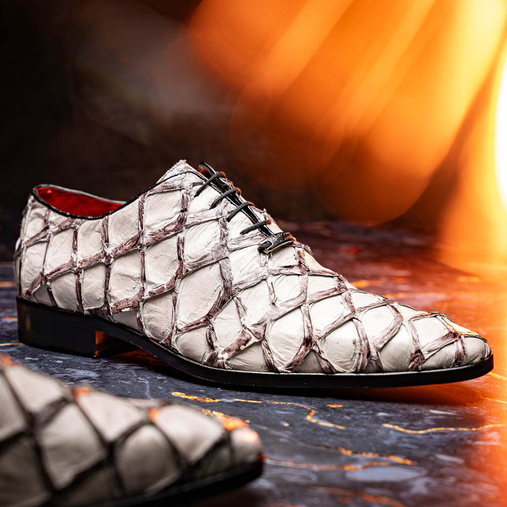 The Marco Di Milano Olivieri Newspaper is a luxury dress oxford featuring a white and gray pattern, black laces, red lining, and brown leather soles—crafted from genuine pirarucu for an elegant statement.
