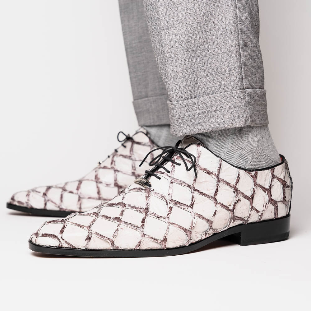 The Marco Di Milano Olivieri Newspaper is a luxury dress oxford featuring a white and gray pattern, black laces, red lining, and brown leather soles—crafted from genuine pirarucu for an elegant statement.