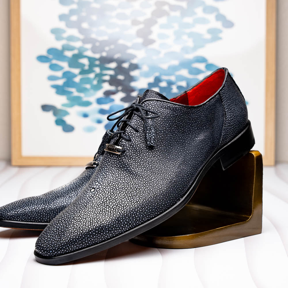 A pair of black textured Pannuci Black oxfords by Marco Di Milano, featuring red inner lining and a tan sole with the brand's logo—luxury footwear for those who value timeless style.
