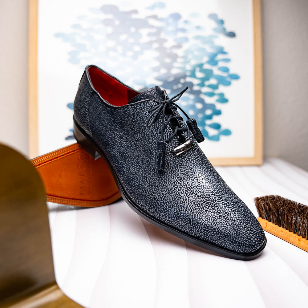 A pair of black textured Pannuci Black oxfords by Marco Di Milano, featuring red inner lining and a tan sole with the brand's logo—luxury footwear for those who value timeless style.