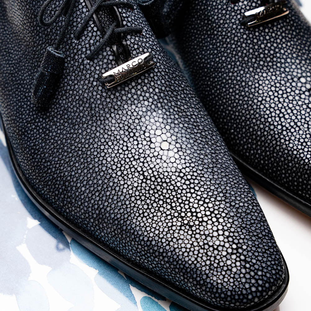 A pair of black textured Pannuci Black oxfords by Marco Di Milano, featuring red inner lining and a tan sole with the brand's logo—luxury footwear for those who value timeless style.