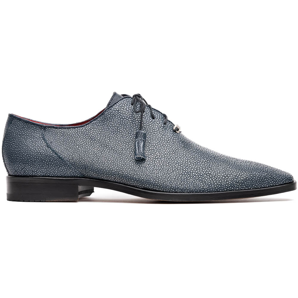 A pair of Marco Di Milano Pannuci Navy dress oxford shoes in textured dark blue leather with black laces, red inner lining, and tan soles—one displayed on its side to showcase the branded sole.