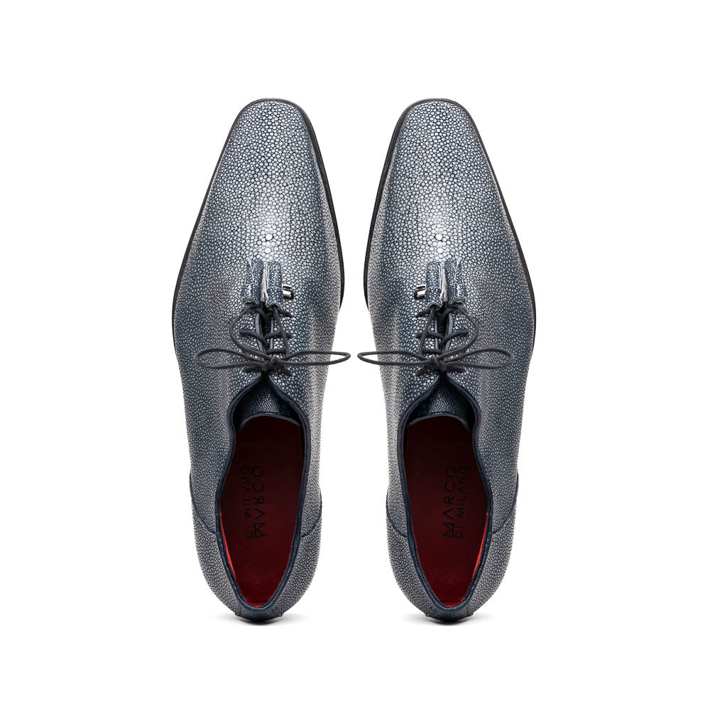 A pair of Marco Di Milano Pannuci Navy dress oxford shoes in textured dark blue leather with black laces, red inner lining, and tan soles—one displayed on its side to showcase the branded sole.