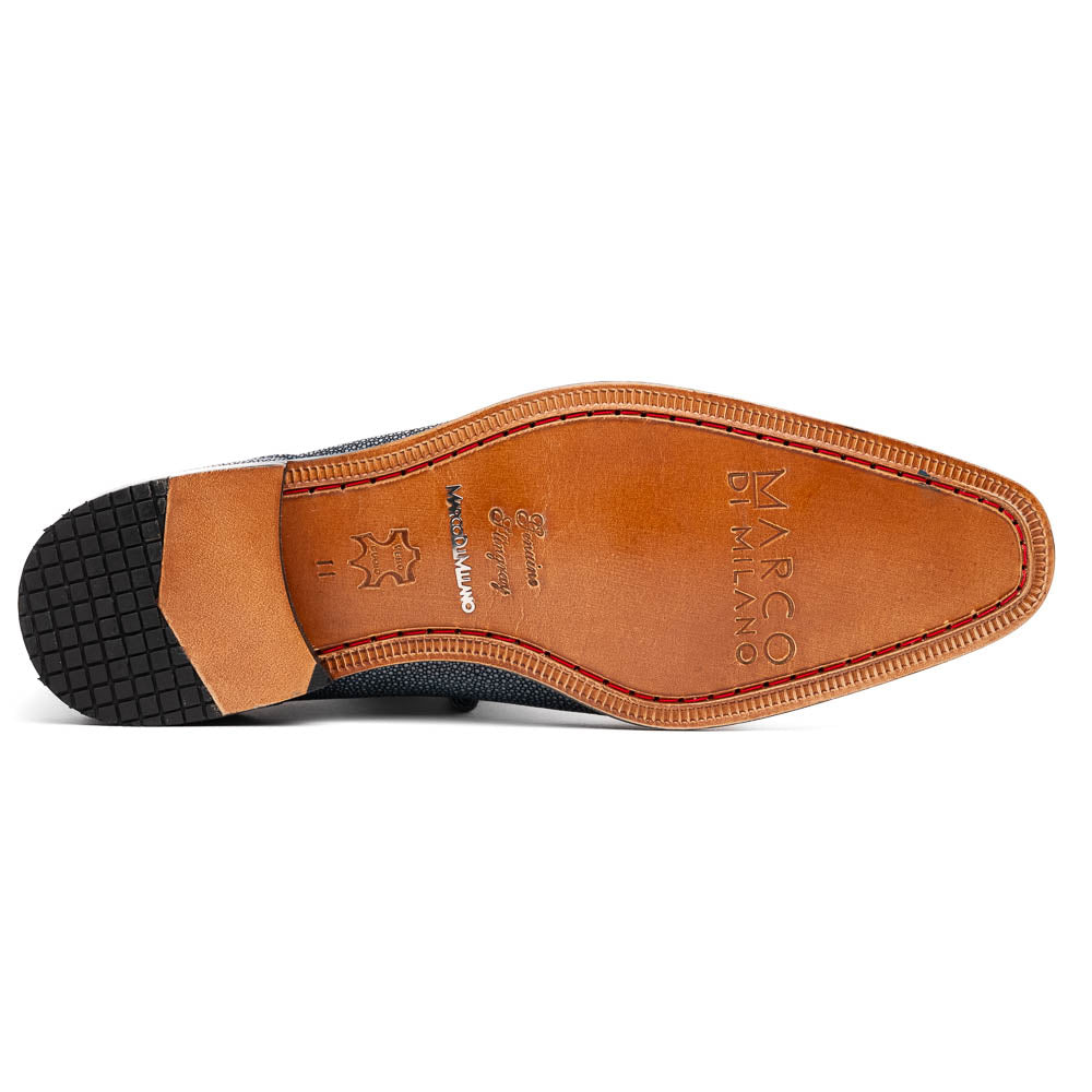 A pair of Marco Di Milano Pannuci Navy dress oxford shoes in textured dark blue leather with black laces, red inner lining, and tan soles—one displayed on its side to showcase the branded sole.