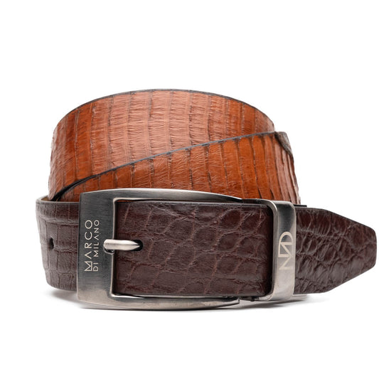 The Moncalieri Belt Brown/Cognac by Marco Di Milano features textured leather, a silver buckle engraved with "Marco Di Milano" and "MD," and is coiled against a white background—crafted to complement their luxury footwear and exotic skin belts.