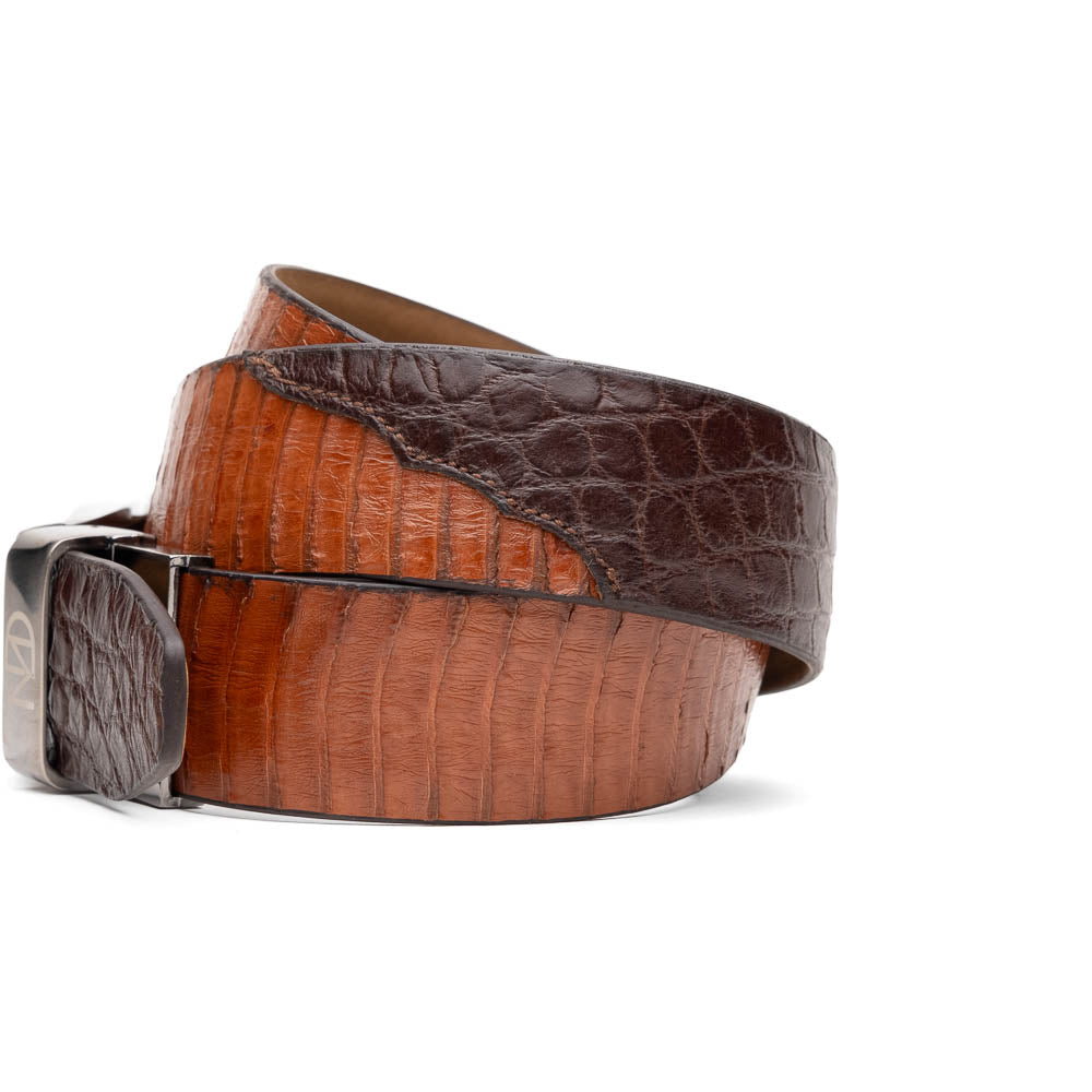 The Moncalieri Belt Brown/Cognac by Marco Di Milano features textured leather, a silver buckle engraved with "Marco Di Milano" and "MD," and is coiled against a white background—crafted to complement their luxury footwear and exotic skin belts.