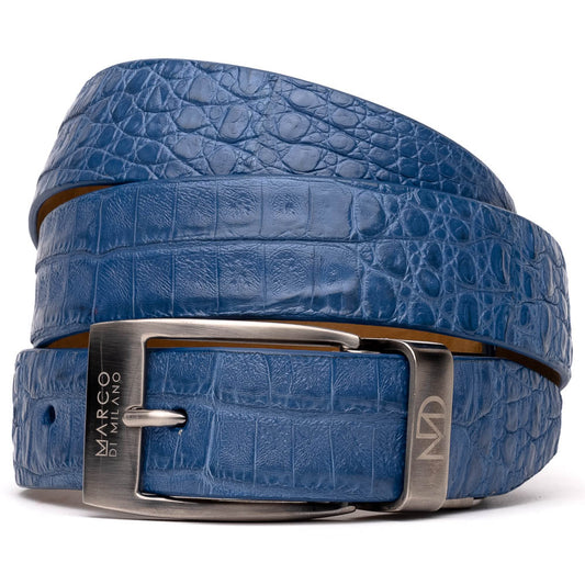 The Riccardo Belt Blue by Marco Di Milano features a caiman fuscus belly with crocodile pattern and a silver buckle engraved with "Marco Di Milano" and "MDM," making it ideal to pair with luxury footwear.