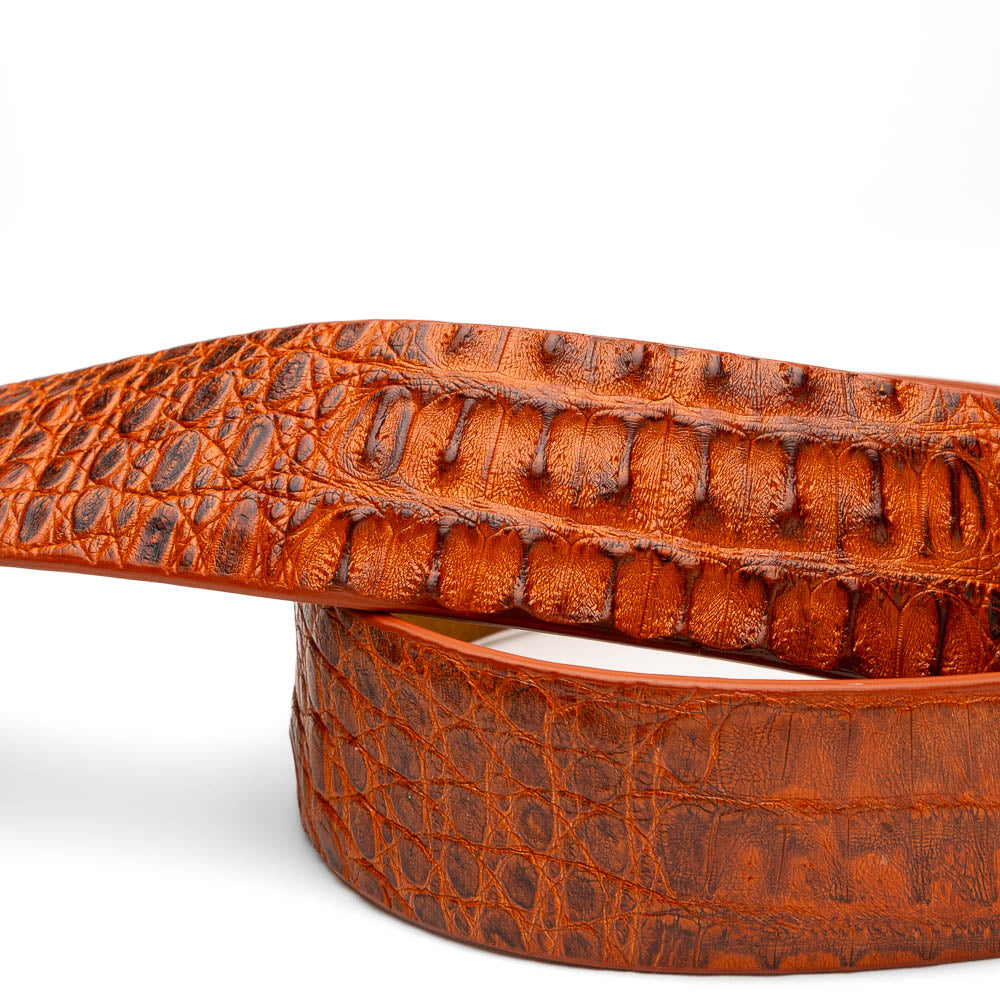The Riccardo Belt Brandy by Marco Di Milano is a brown exotic leather belt with a crocodile pattern, silver buckle engraved with "Marco Di Milano" and "MD," styled after caiman fuscus-belly belts for a refined look.