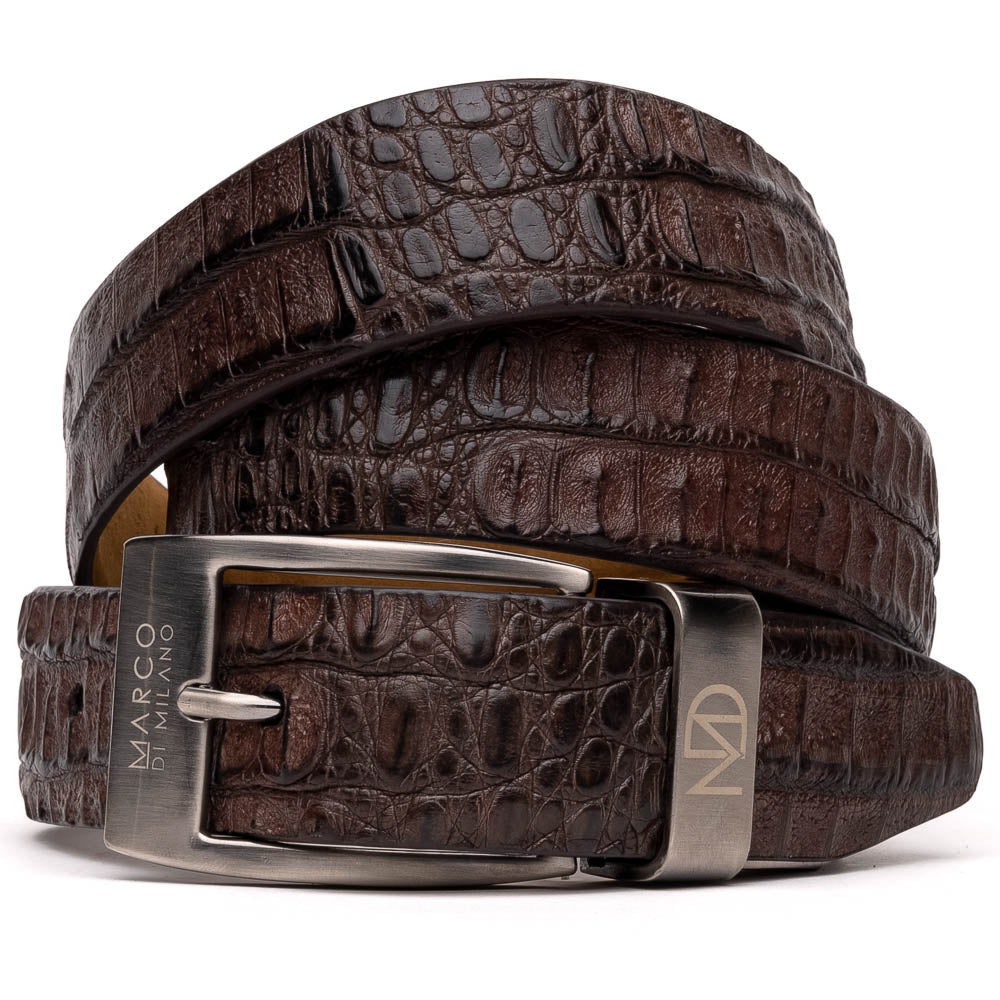 The Riccardo Belt Brown by Marco Di Milano is a dark brown exotic leather belt with a silver buckle and an engraved logo, crafted to mimic genuine caiman belly.