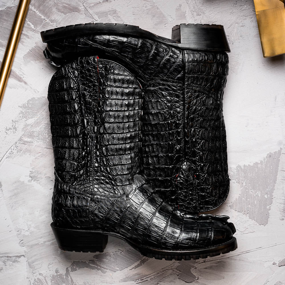 The Marlboro Black by Marco Di Milano: black hornback caiman cowboy boots with a crocodile skin pattern and low heels, shown on a white background.