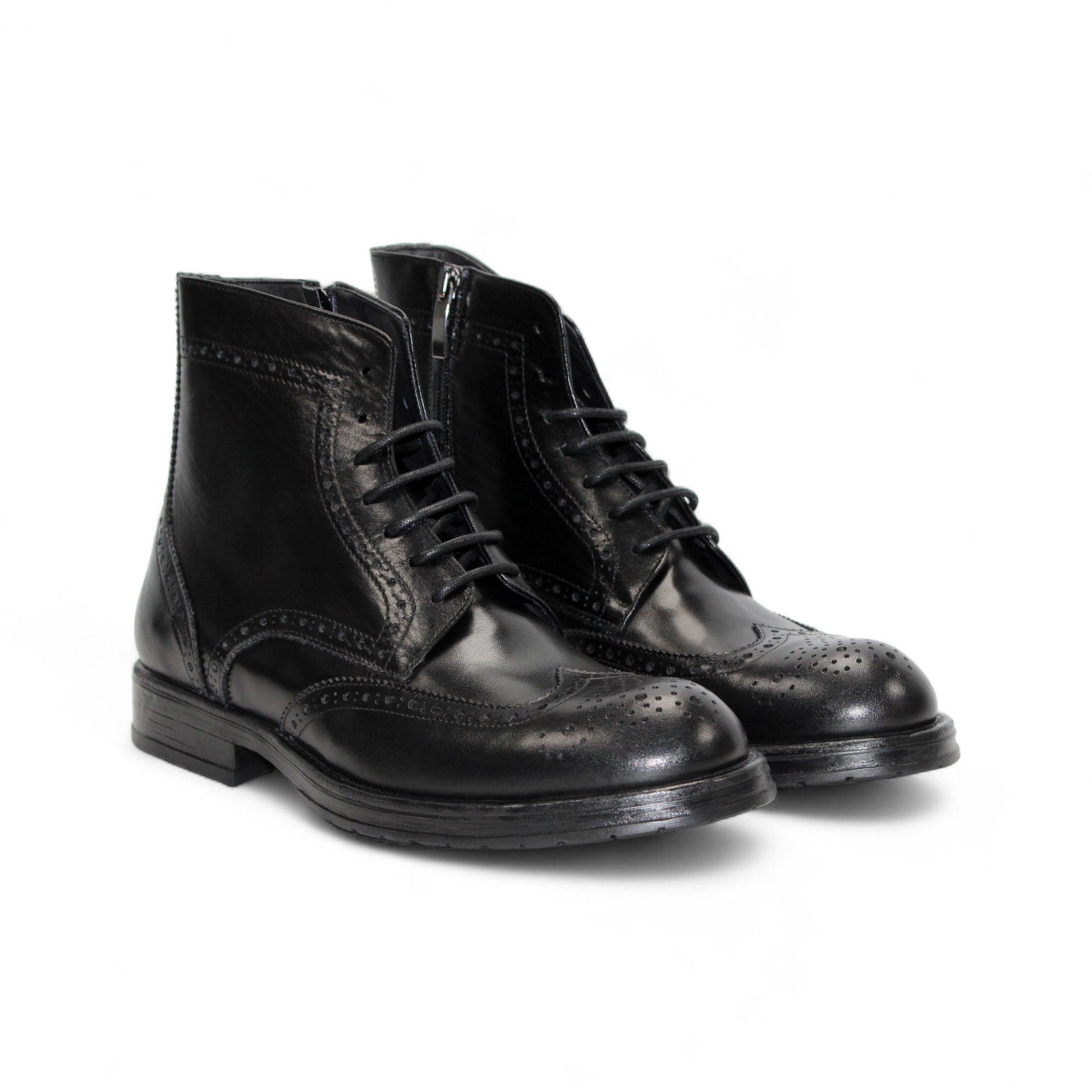 The Firmani Daniel Black ankle boot by Firmani features black genuine leather, brogue detailing, and lace-up closure, shown in a side profile against a white background.