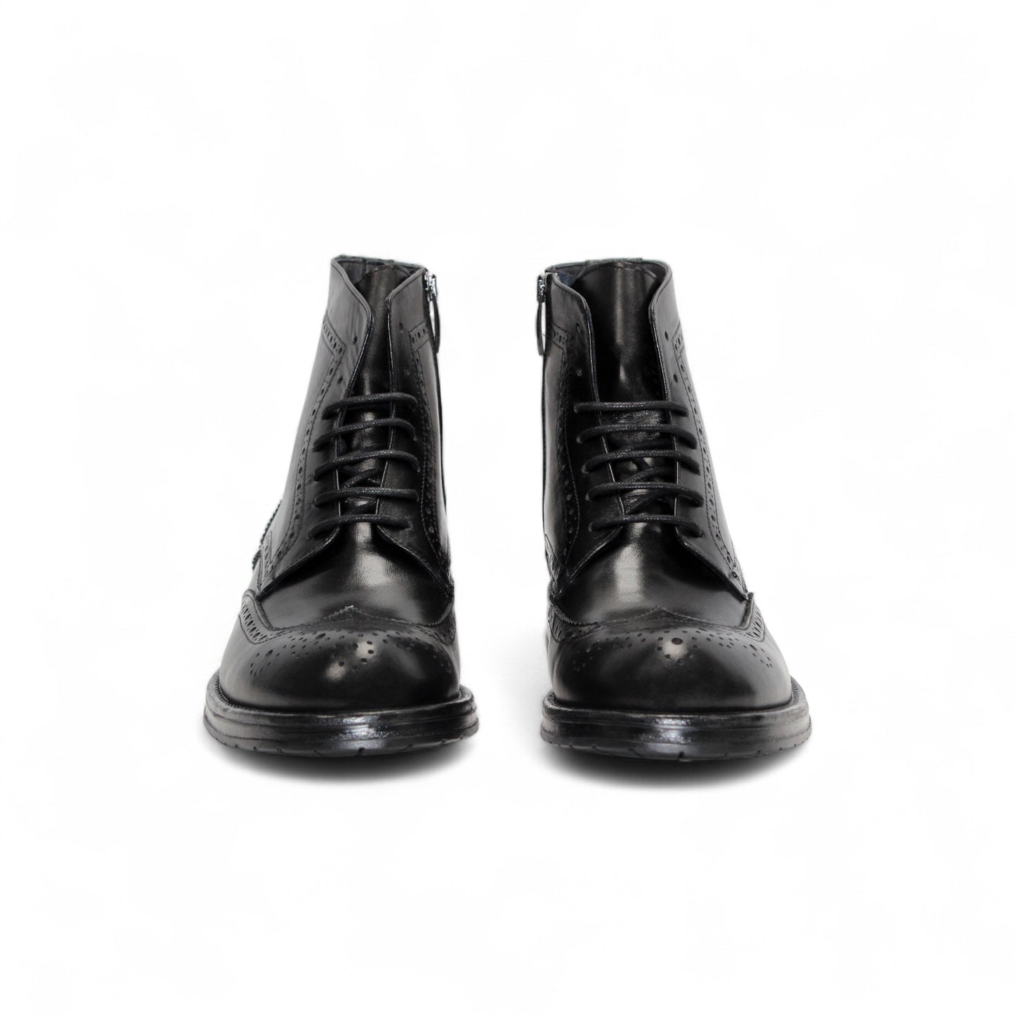 The Firmani Daniel Black ankle boot by Firmani features black genuine leather, brogue detailing, and lace-up closure, shown in a side profile against a white background.