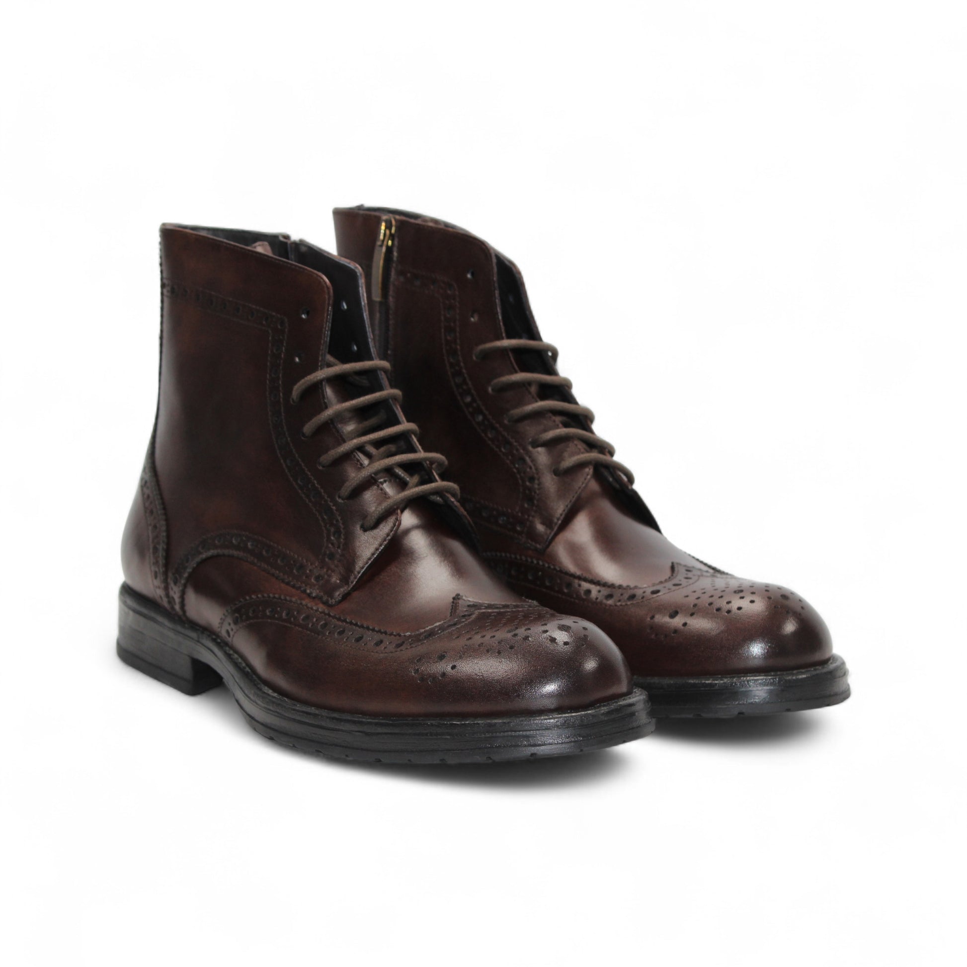 The Firmani Daniel Brown by Firmani is a brown genuine leather brogue boot with wingtip details and laces, displayed side view on a white background.