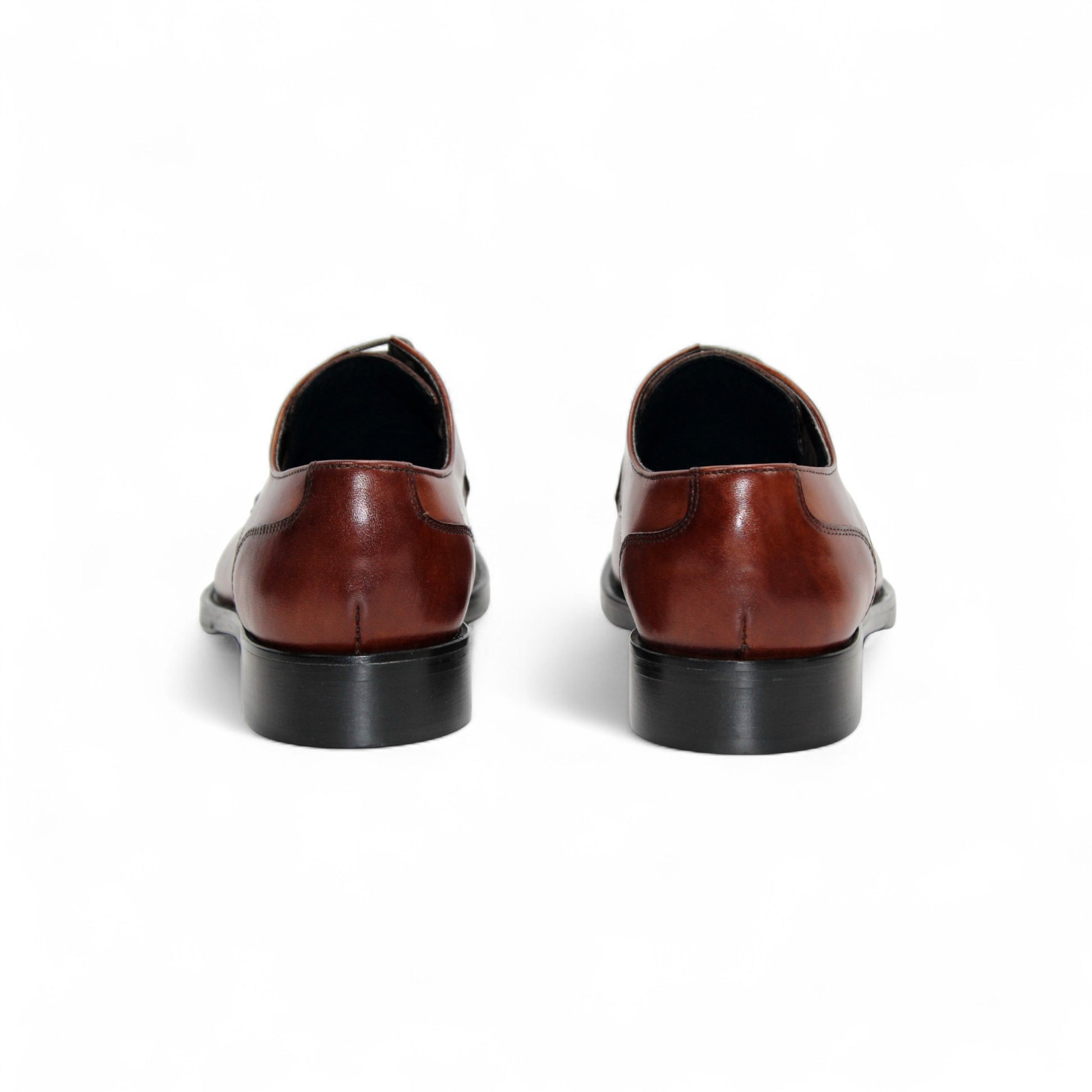 The Firmani David Brandy by Firmani is a brown genuine leather dress shoe with laces and decorative toe perforations, shown in side profile against a white background.