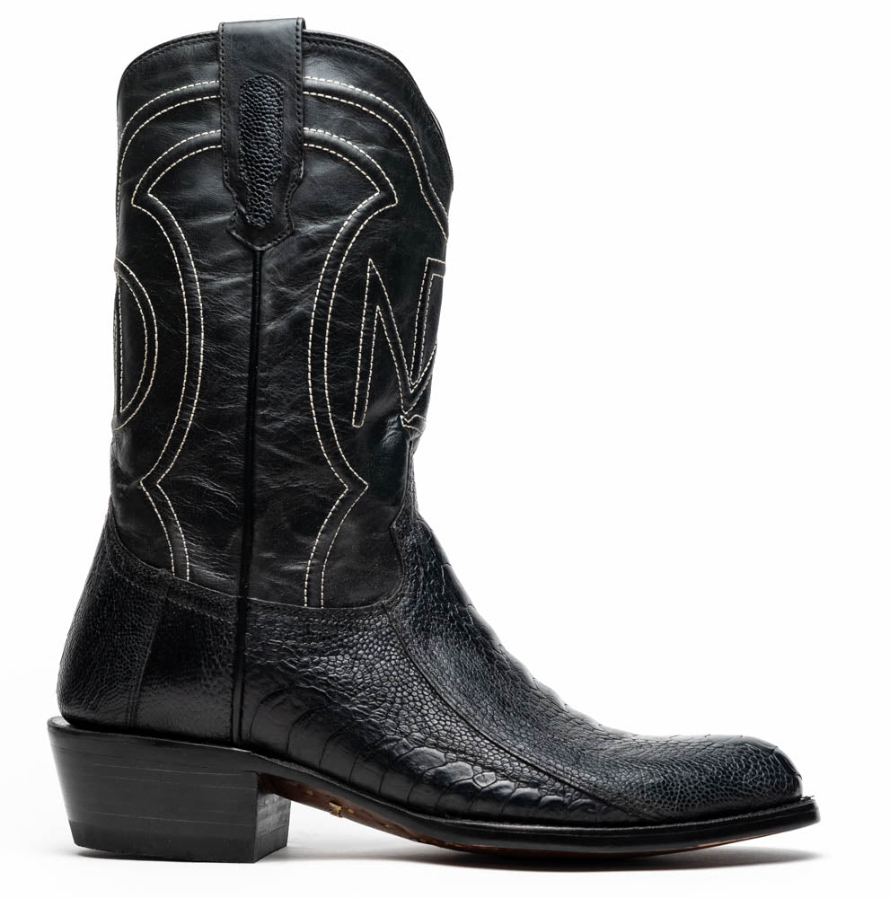 A pair of Denver Black cowboy boots by Marco Di Milano in genuine black ostrich leather, one upright and one displaying the sole with white stitching and the Marco Di Milano logo.