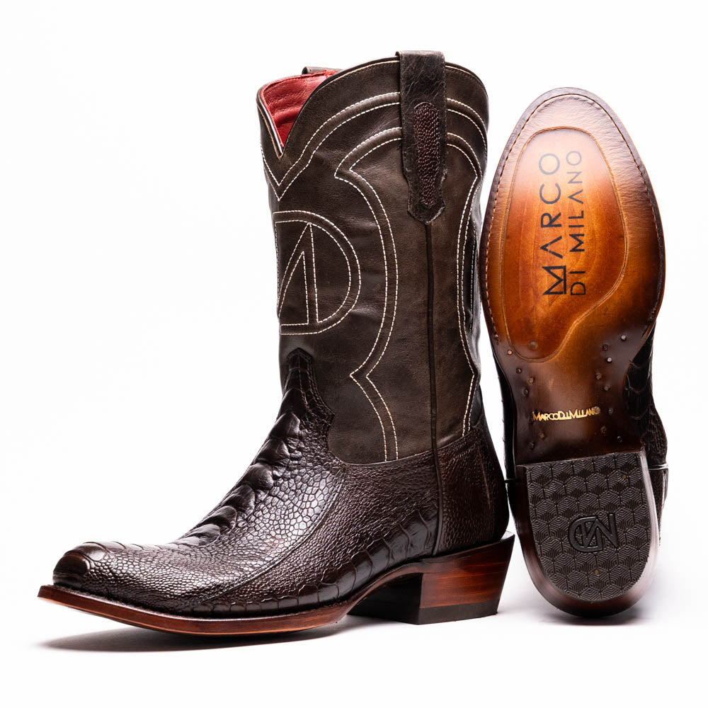 A pair of Denver Brown Western boots by Marco Di Milano in dark brown textured leather, featuring contrast stitching and genuine ostrich style; one boot shows the branded sole.