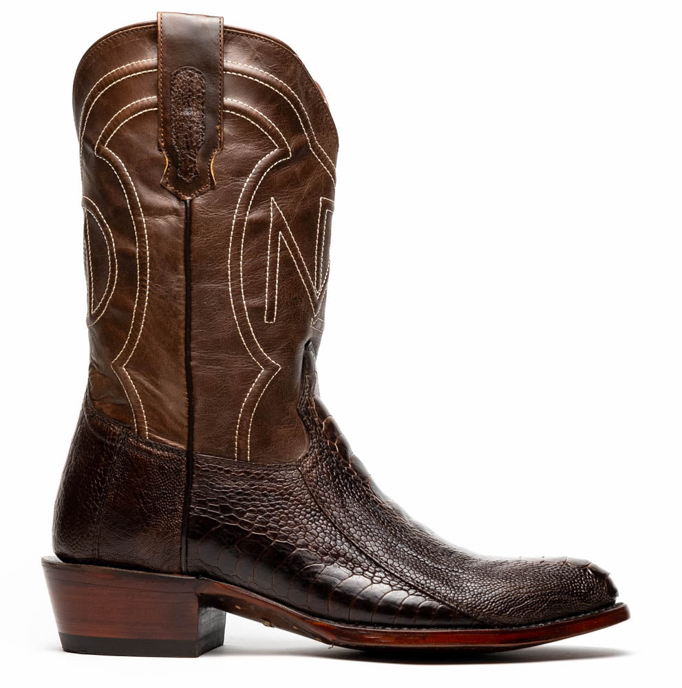 The Denver Clear Brown by Marco Di Milano are textured leather Western cowboy boots in brown, featuring white stitching and branded soles.