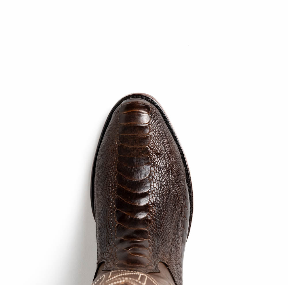 The Denver Clear Brown by Marco Di Milano are textured leather Western cowboy boots in brown, featuring white stitching and branded soles.