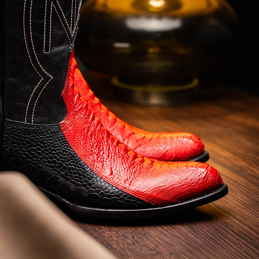 The Marco Di Milano Denver Red / Black boots feature red and black leather, a textured pattern, decorative stitching, and a branded sole—one boot stands upright while the other displays the sole.