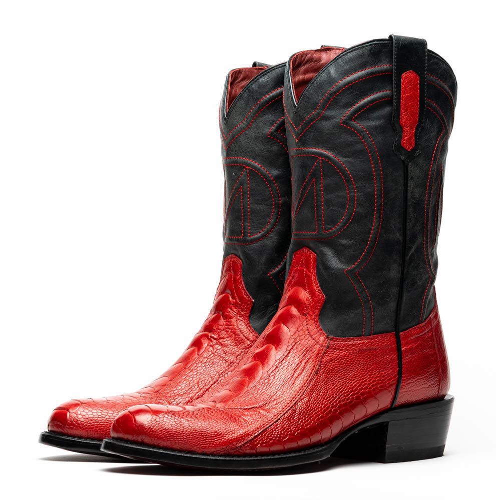 The Denver Red boots by Marco Di Milano feature bold red and black genuine ostrich skin—one boot upright, one showing the sole with the signature logo—for a striking, luxurious Western style.