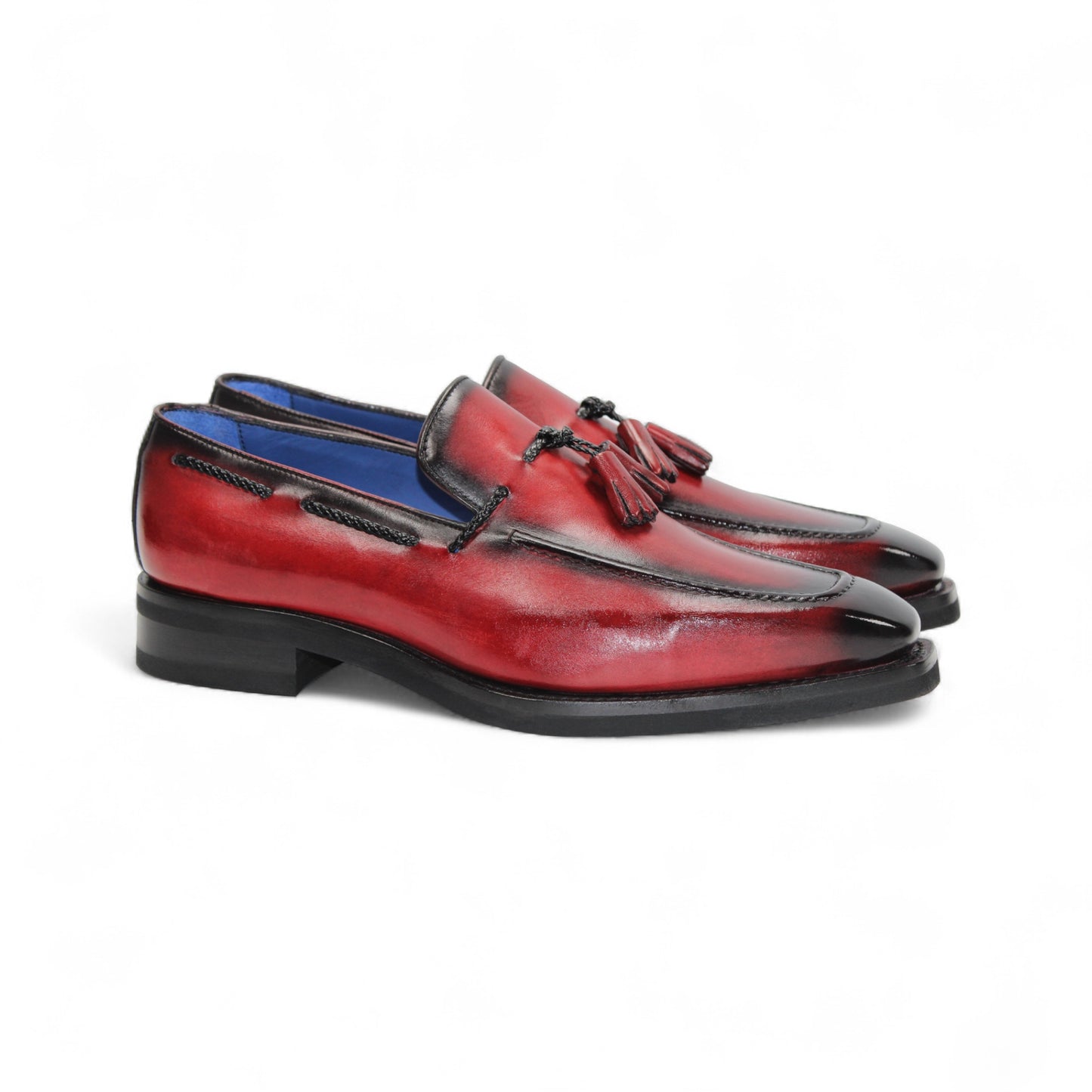 The Emilio Franco Dino Red/Black loafer features genuine red leather with black accents, tassel detail, a low black heel, handcrafted in Italy by Emilio Franco, and shown on a white background.