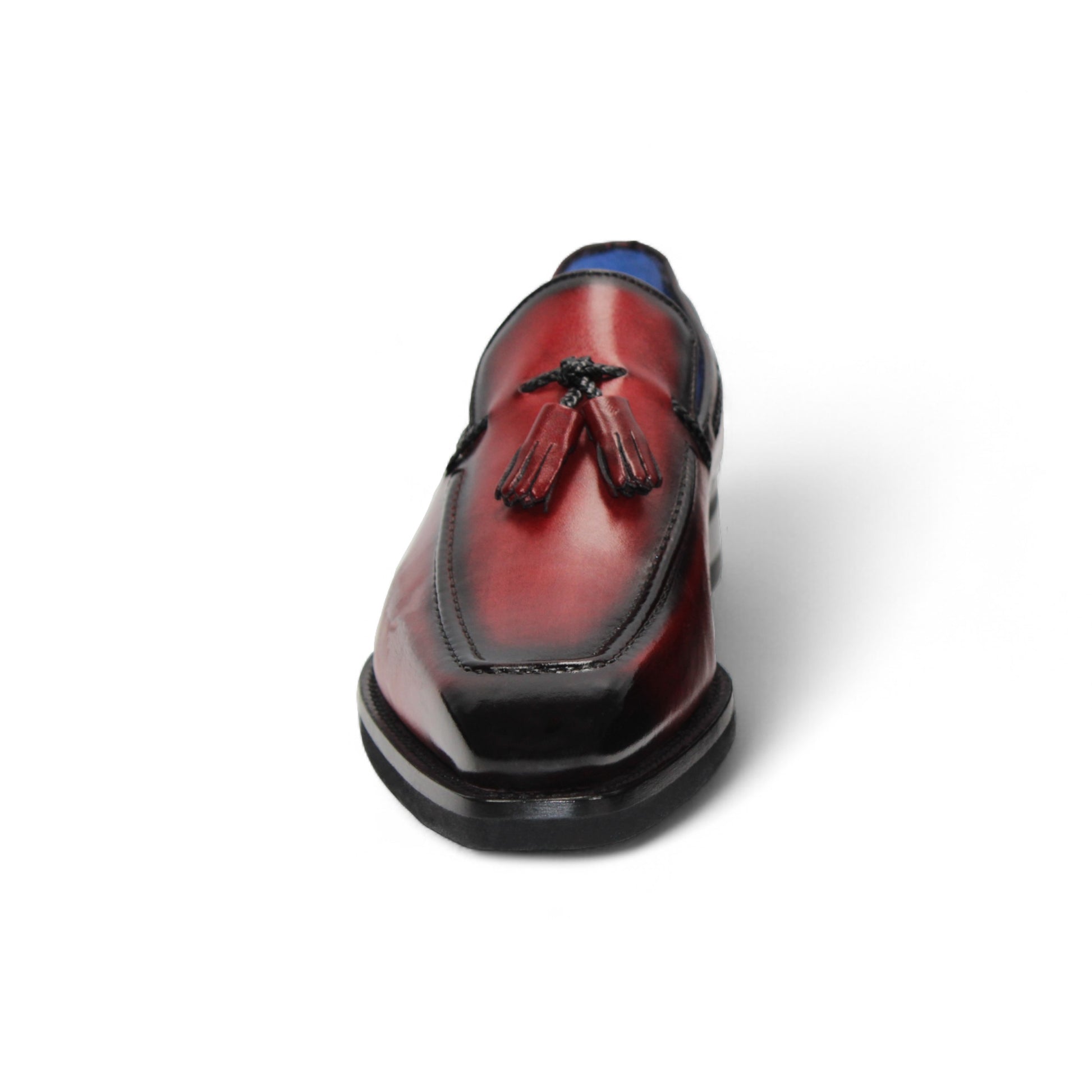 The Emilio Franco Dino Red/Black loafer features genuine red leather with black accents, tassel detail, a low black heel, handcrafted in Italy by Emilio Franco, and shown on a white background.