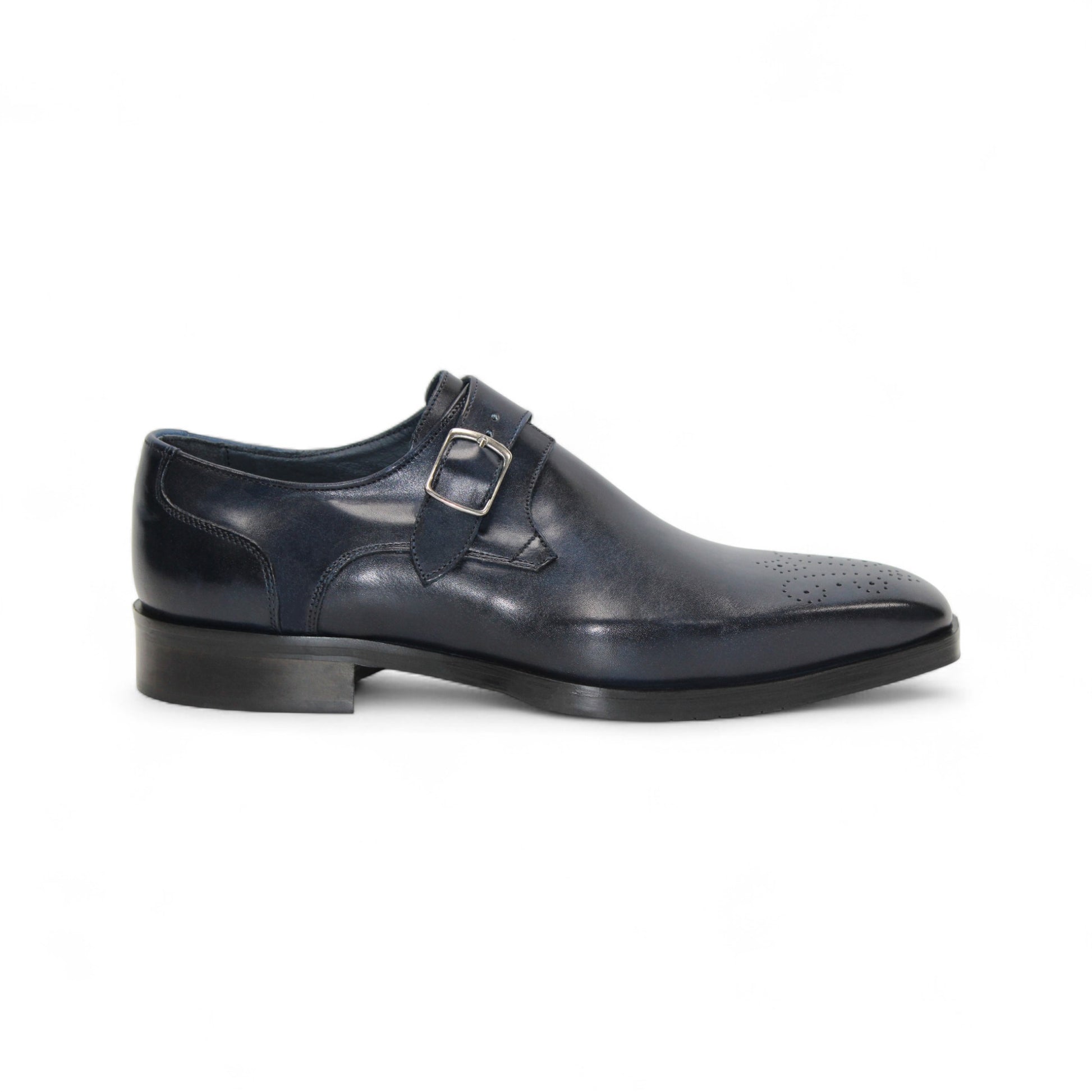 The Firmani Duncan Navy by Firmani is a navy genuine leather monk strap dress shoe with a silver buckle, low heel, and perforated toe detailing, displayed against a white background.