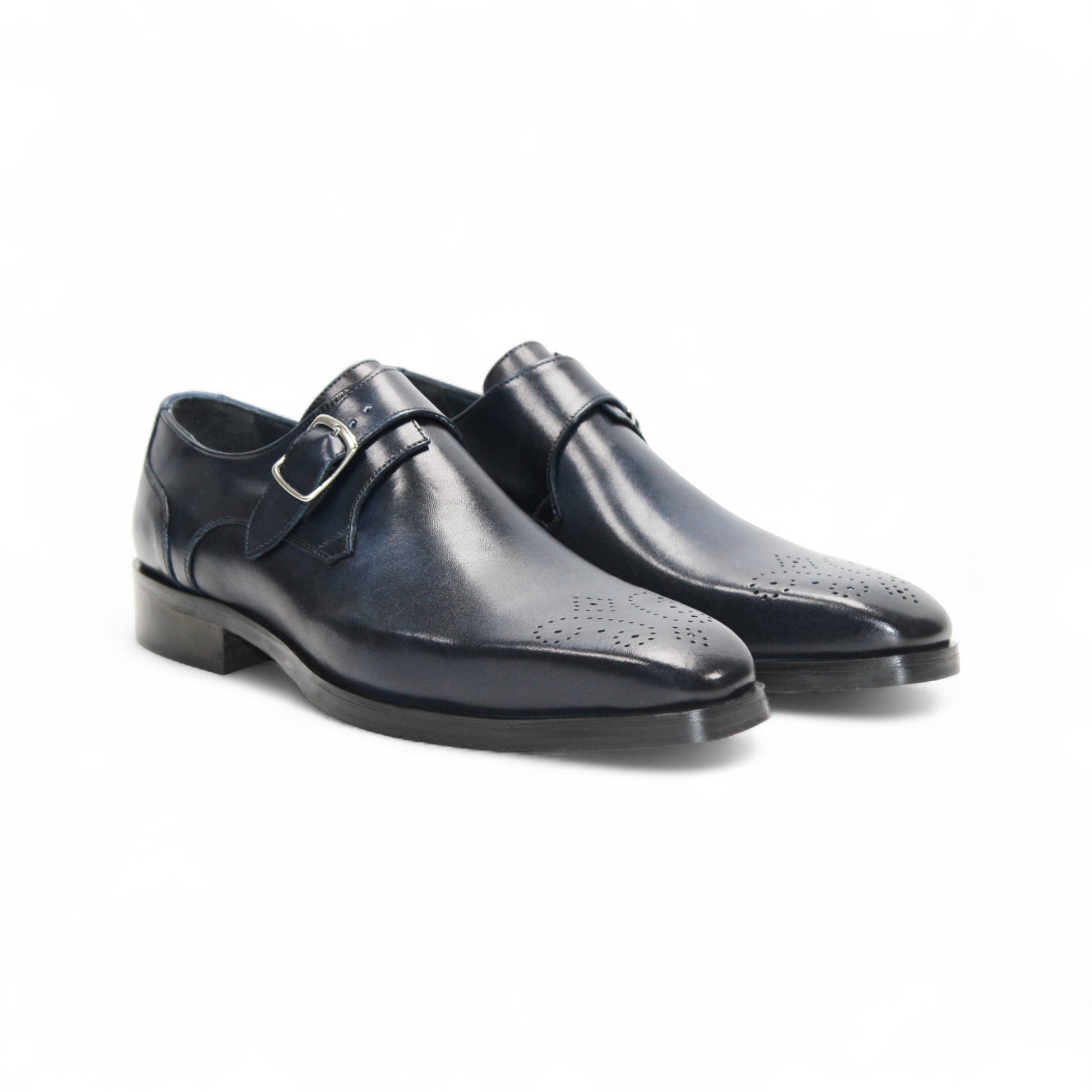 The Firmani Duncan Navy by Firmani is a navy genuine leather monk strap dress shoe with a silver buckle, low heel, and perforated toe detailing, displayed against a white background.