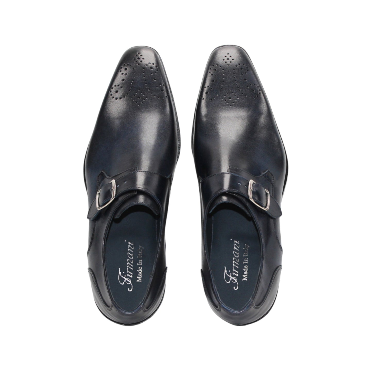 The Firmani Duncan Navy by Firmani is a navy genuine leather monk strap dress shoe with a silver buckle, low heel, and perforated toe detailing, displayed against a white background.