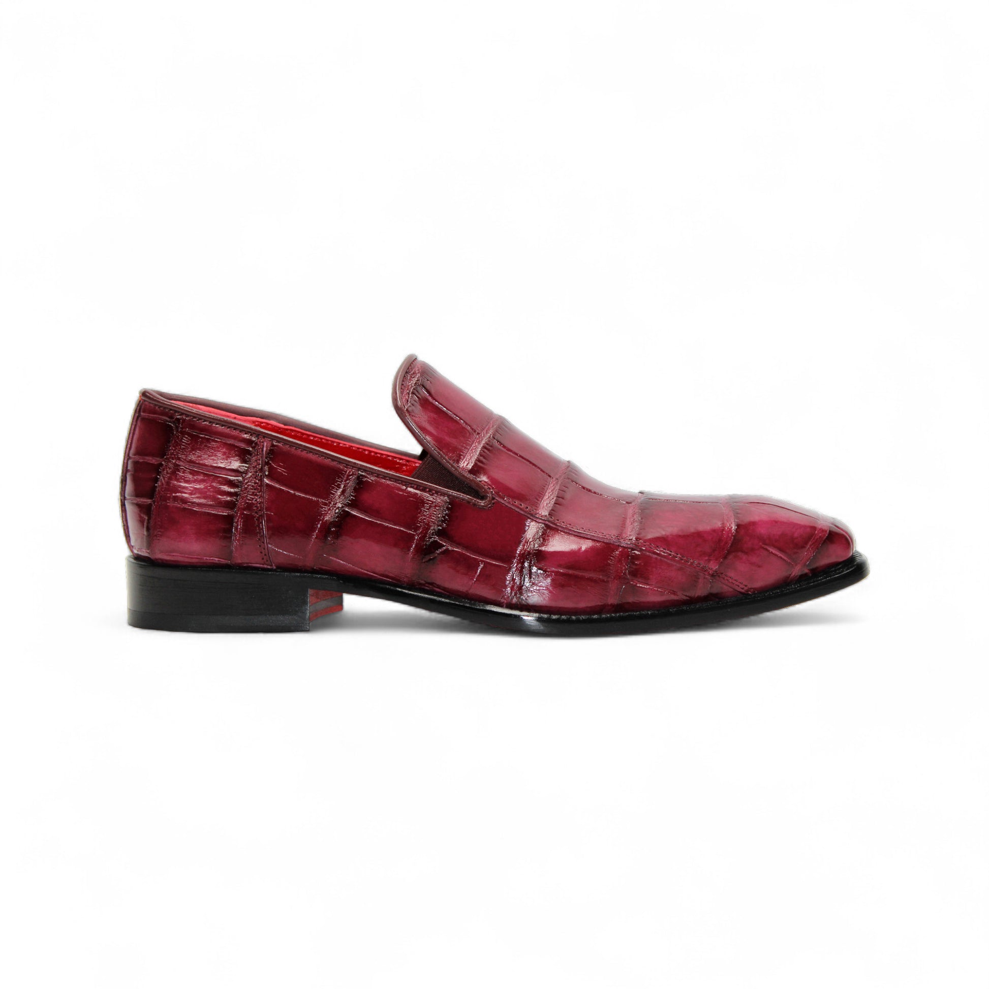 The Fennix Dustin Bordo by Fennix of Italy is a single burgundy loafer in genuine alligator leather with a crocodile pattern, leather sole, and low black heel, displayed on a white background.