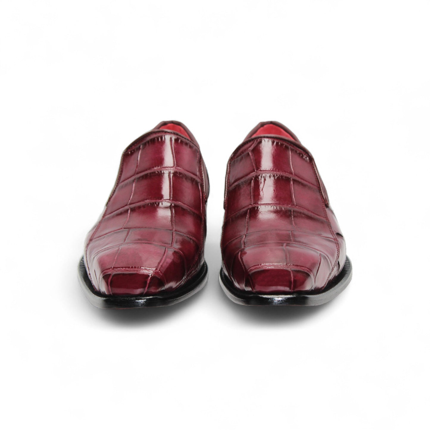 The Fennix Dustin Bordo by Fennix of Italy is a single burgundy loafer in genuine alligator leather with a crocodile pattern, leather sole, and low black heel, displayed on a white background.