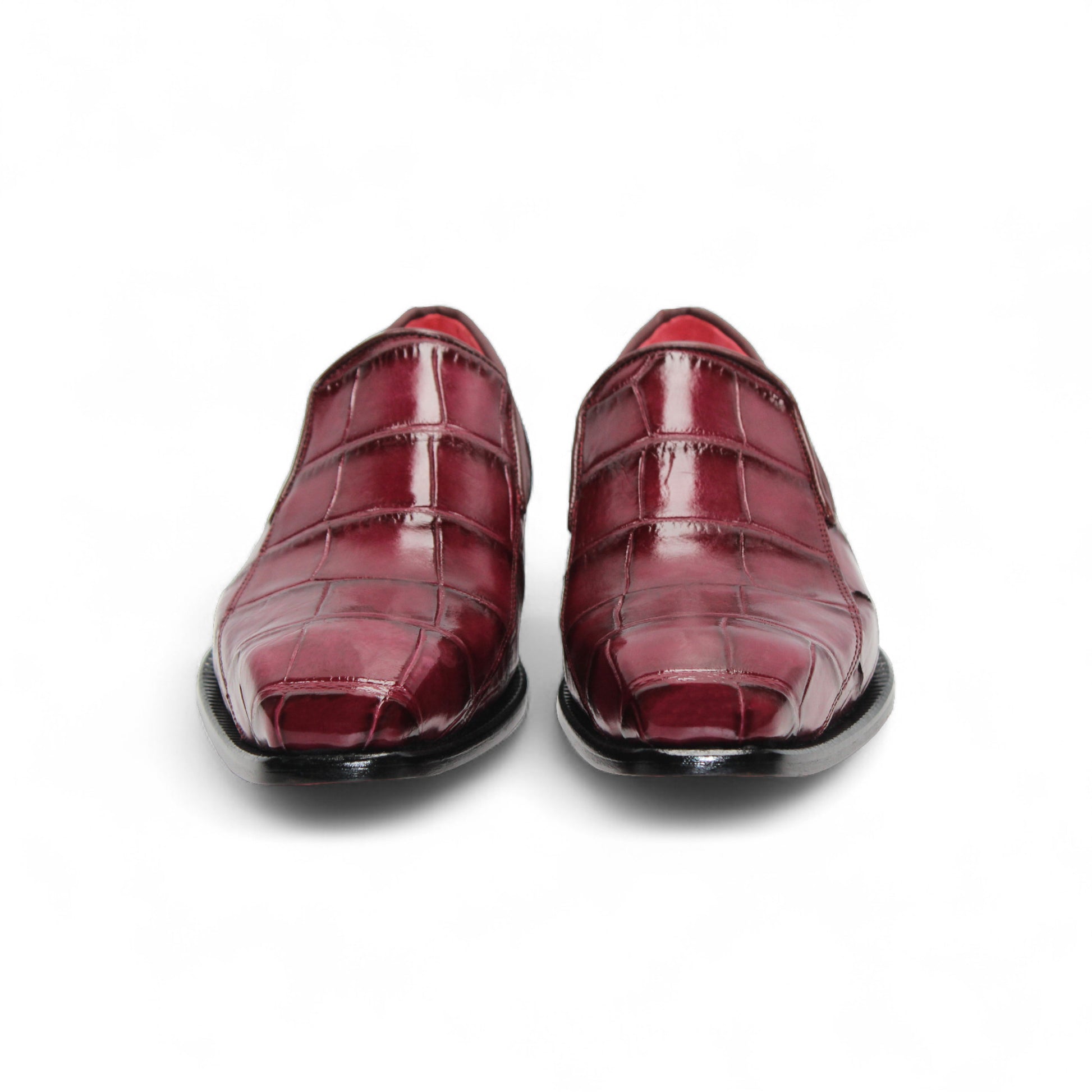 The Fennix Dustin Bordo by Fennix of Italy is a single burgundy loafer in genuine alligator leather with a crocodile pattern, leather sole, and low black heel, displayed on a white background.