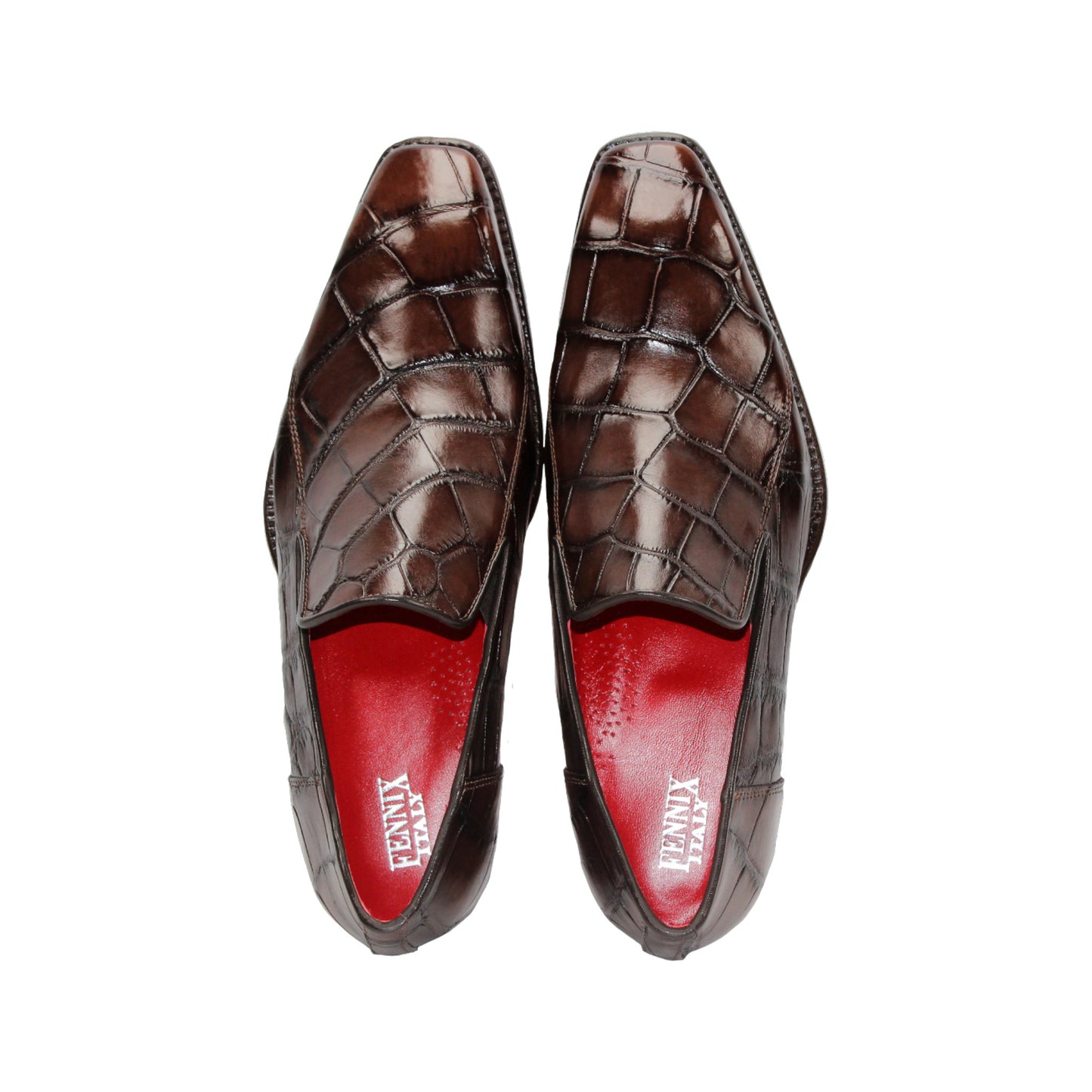 The Fennix Dustin Brown loafer by Fennix of Italy features premium brown leather, Italian craftsmanship, a textured pattern, low heel, and red interior lining, showcased in a side profile against a white background.