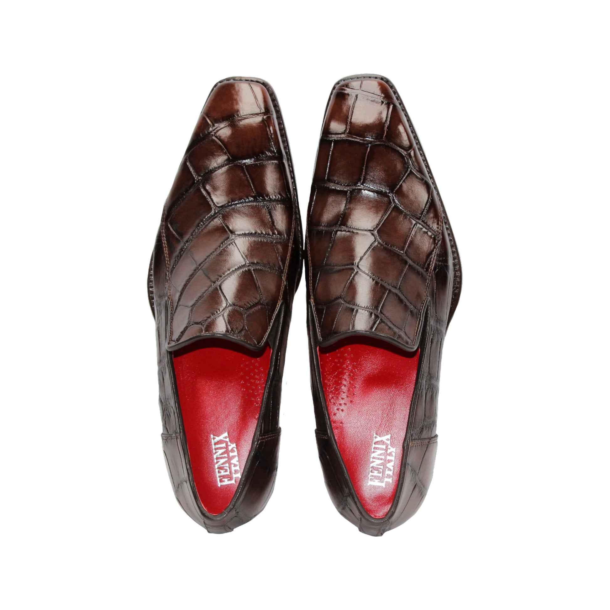 The Fennix Dustin Brown loafer by Fennix of Italy features premium brown leather, Italian craftsmanship, a textured pattern, low heel, and red interior lining, showcased in a side profile against a white background.