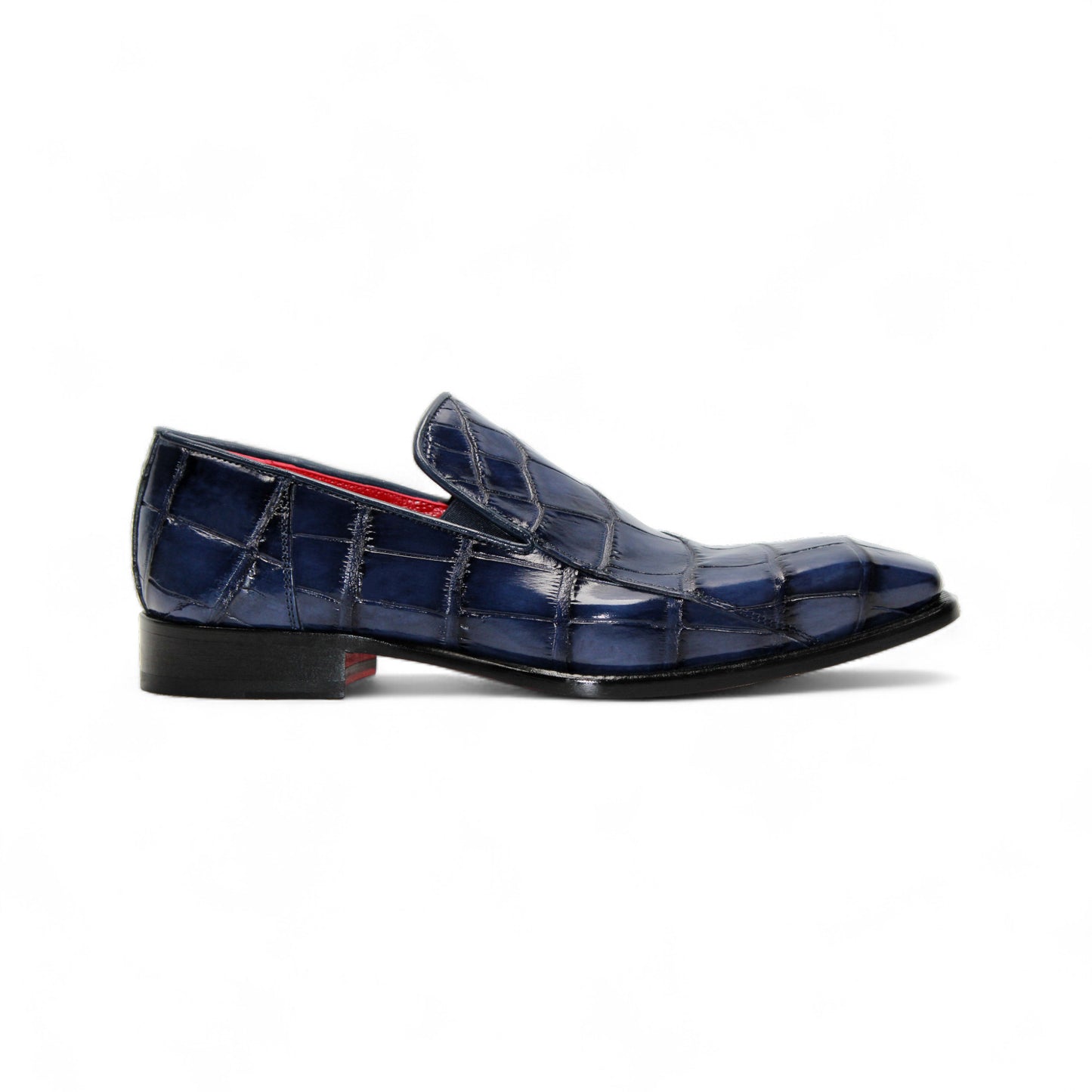 The Fennix Dustin Navy loafer by Fennix of Italy features genuine navy alligator leather with a crocodile pattern and low heel, highlighting Italian craftsmanship, shown on a white background.