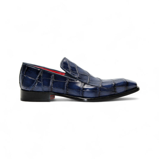 The Fennix Dustin Navy loafer by Fennix of Italy features genuine navy alligator leather with a crocodile pattern and low heel, highlighting Italian craftsmanship, shown on a white background.