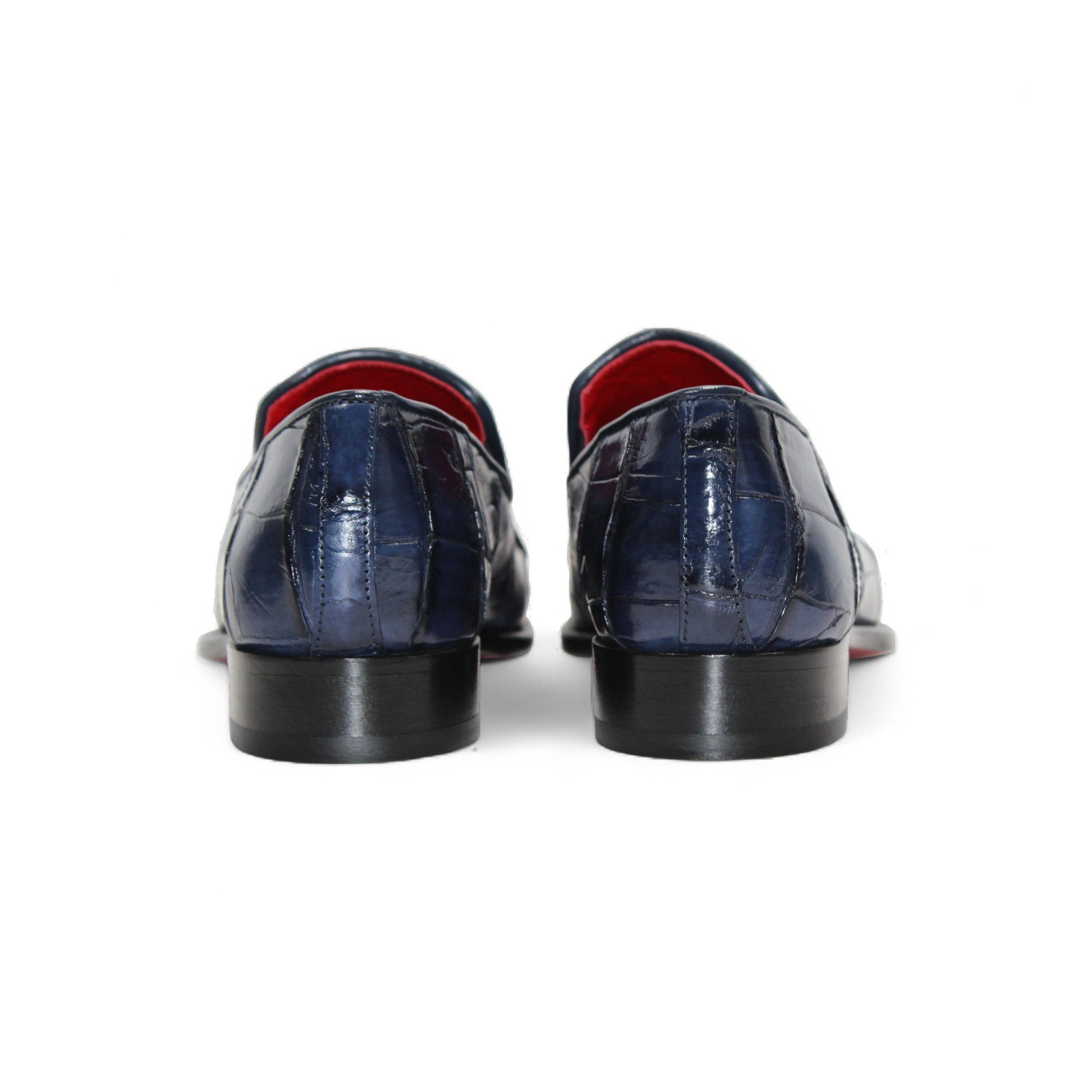 The Fennix Dustin Navy loafer by Fennix of Italy features genuine navy alligator leather with a crocodile pattern and low heel, highlighting Italian craftsmanship, shown on a white background.